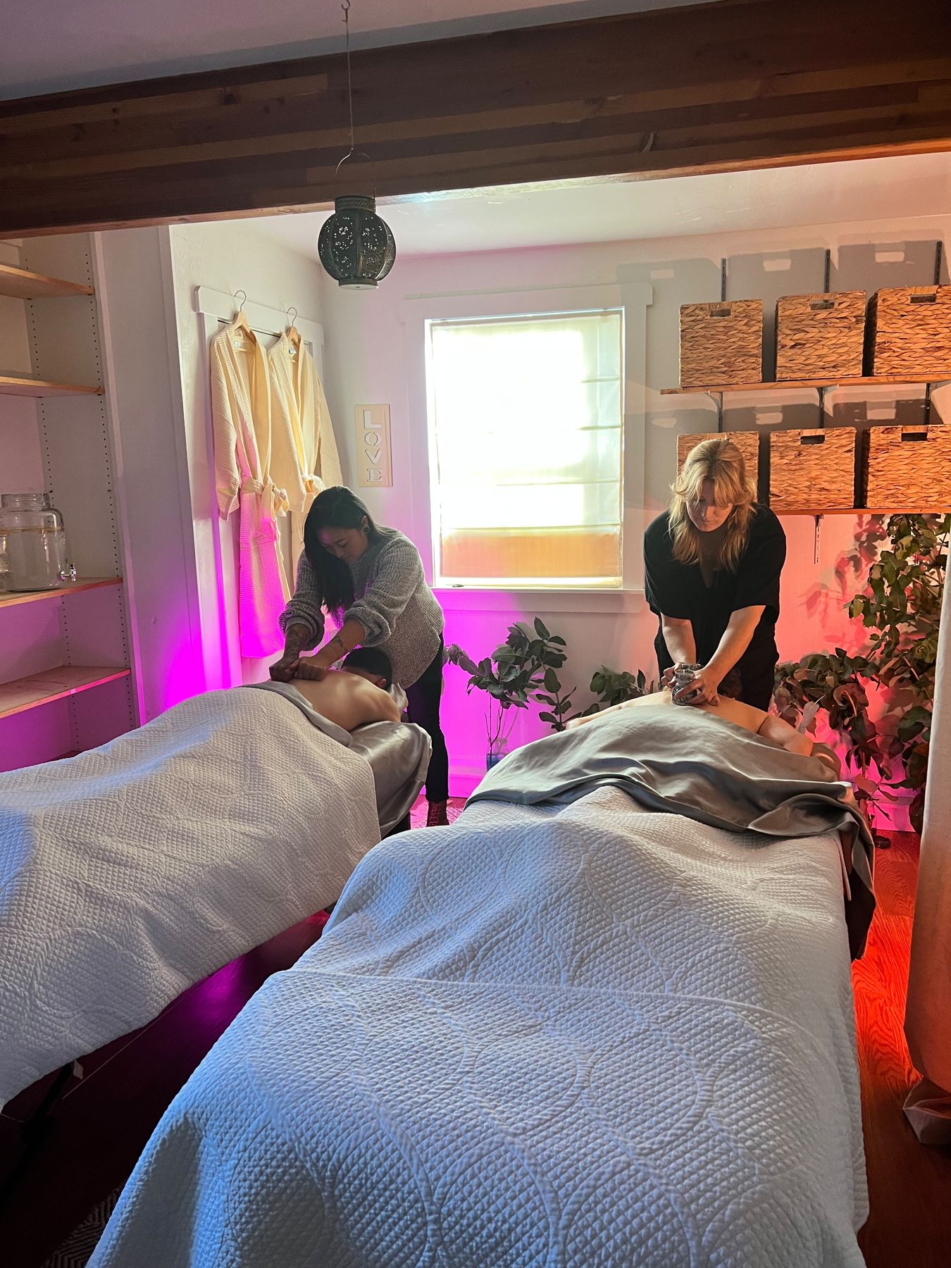 Two massage tables in a treatment room